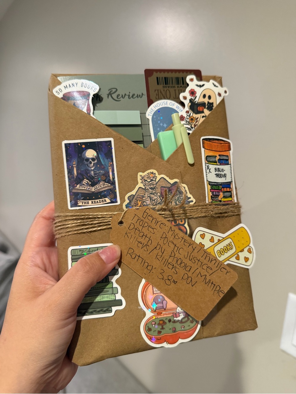 Handmade Kraft Paper Notebook with Green Pen and Sticker Accents